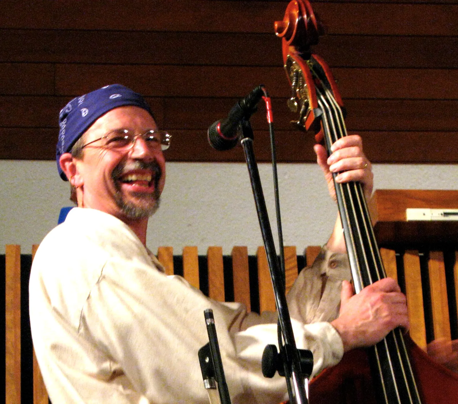Mark Szabo playing upright bass with blue bandana